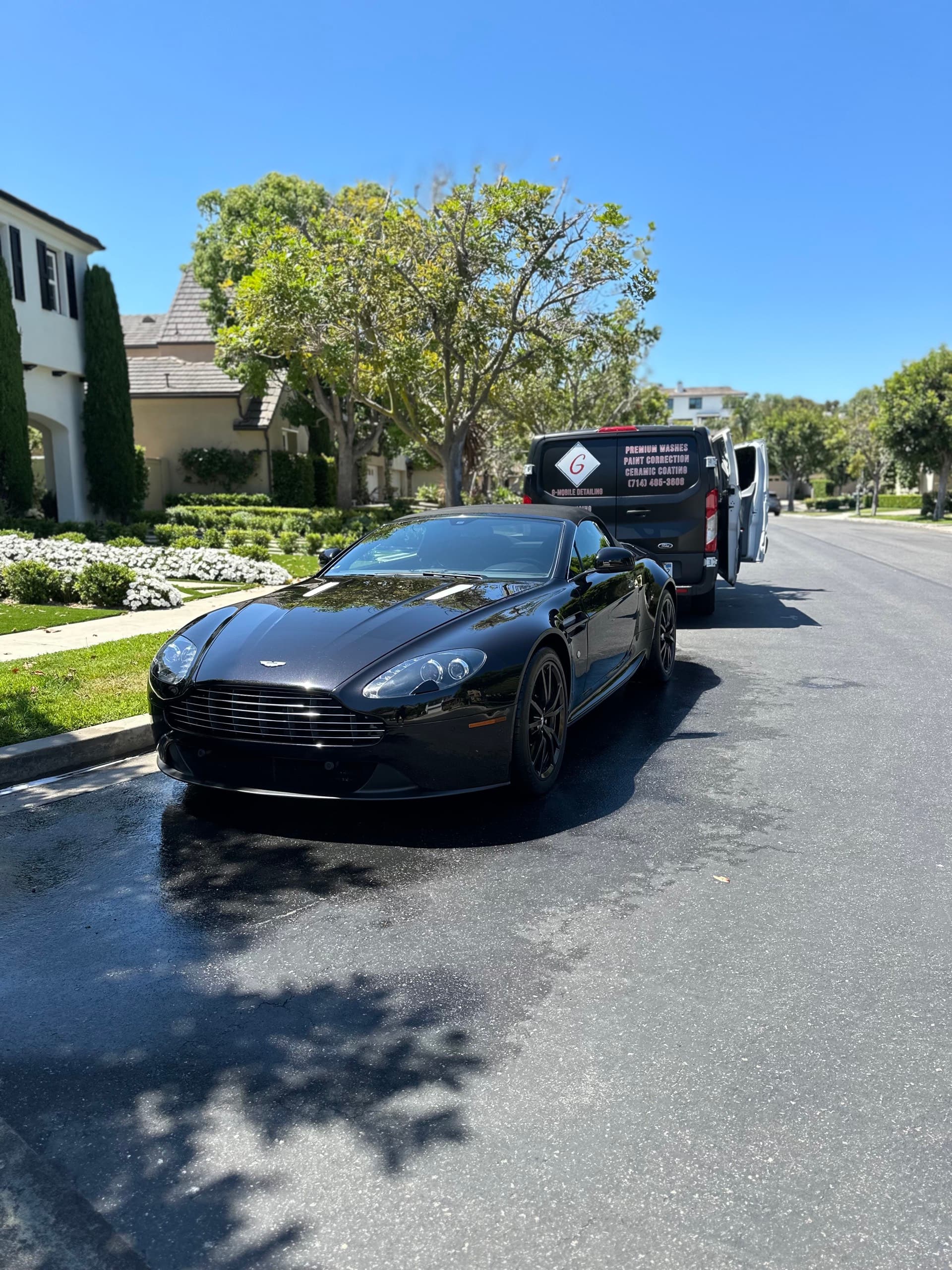 Black Aston Martin Vantage with G Mobile Detailing van