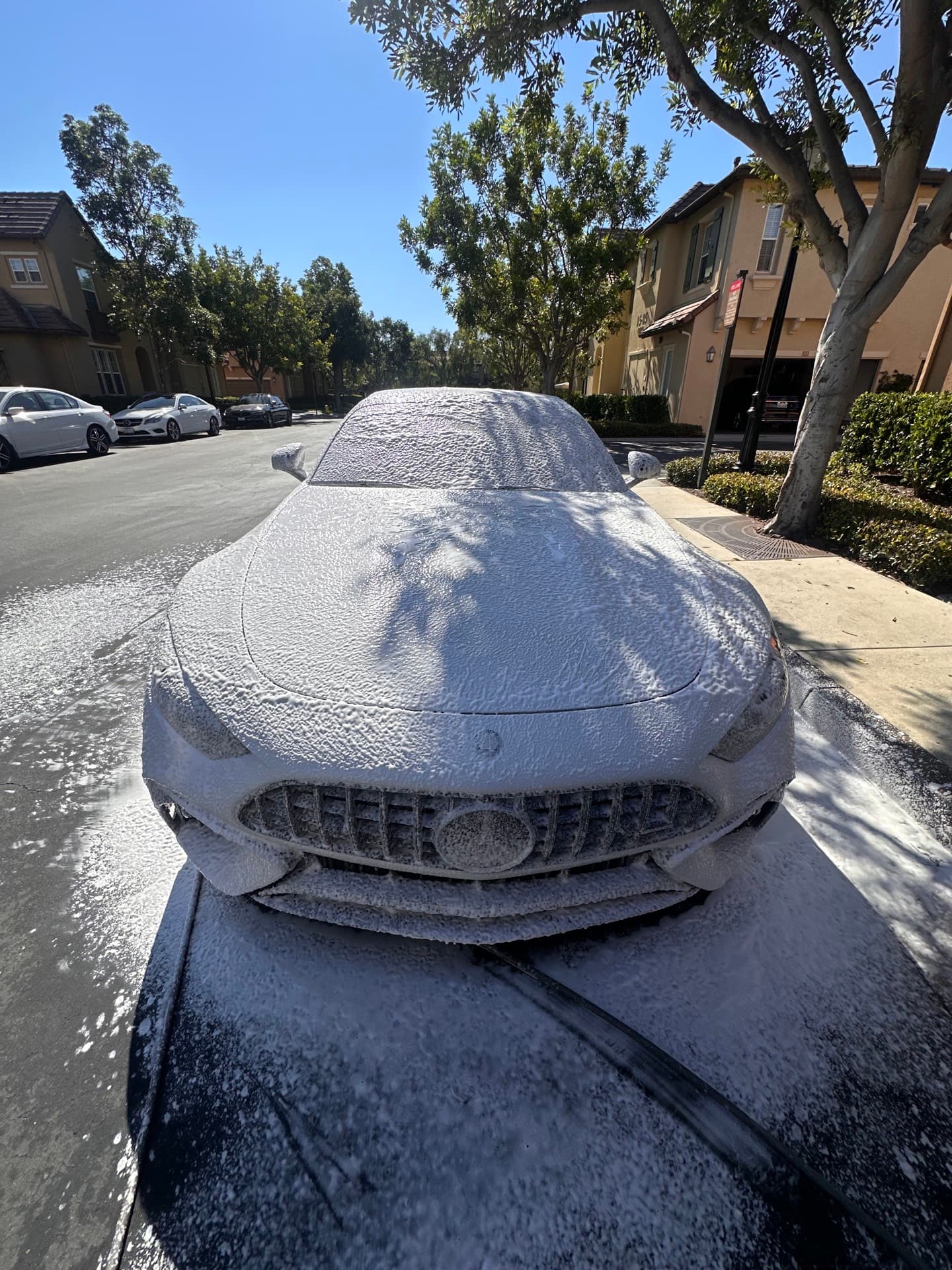 Mercedes GT 63 covered in foam during mobile car wash
