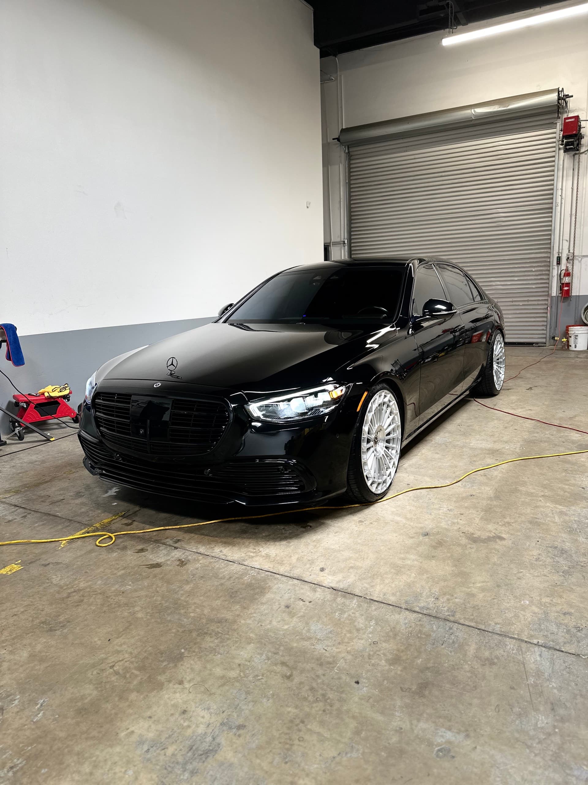 Black Mercedes S-Class front view after studio detail