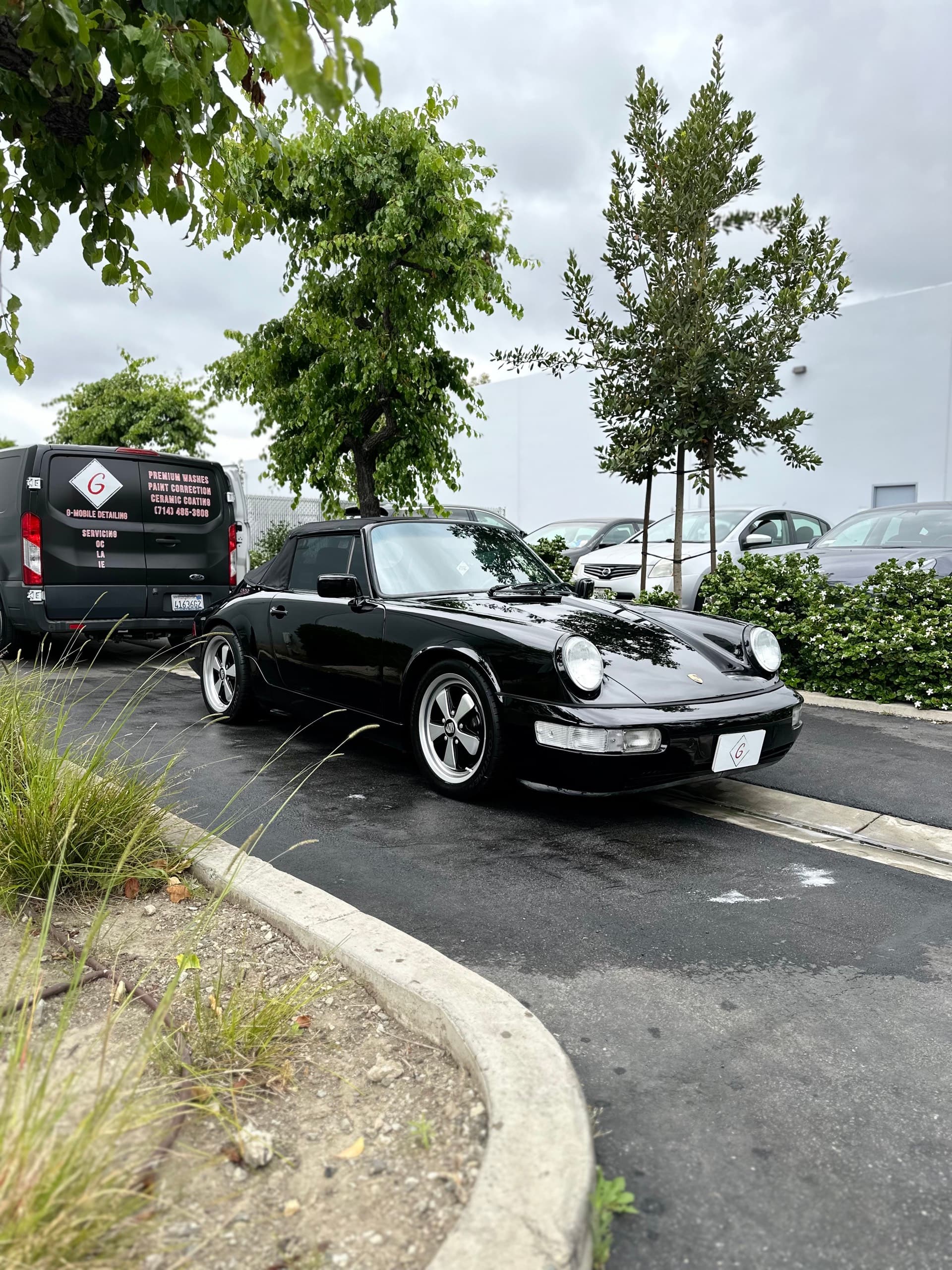 Black classic Porsche 911 with G Mobile Detailing van in Orange County