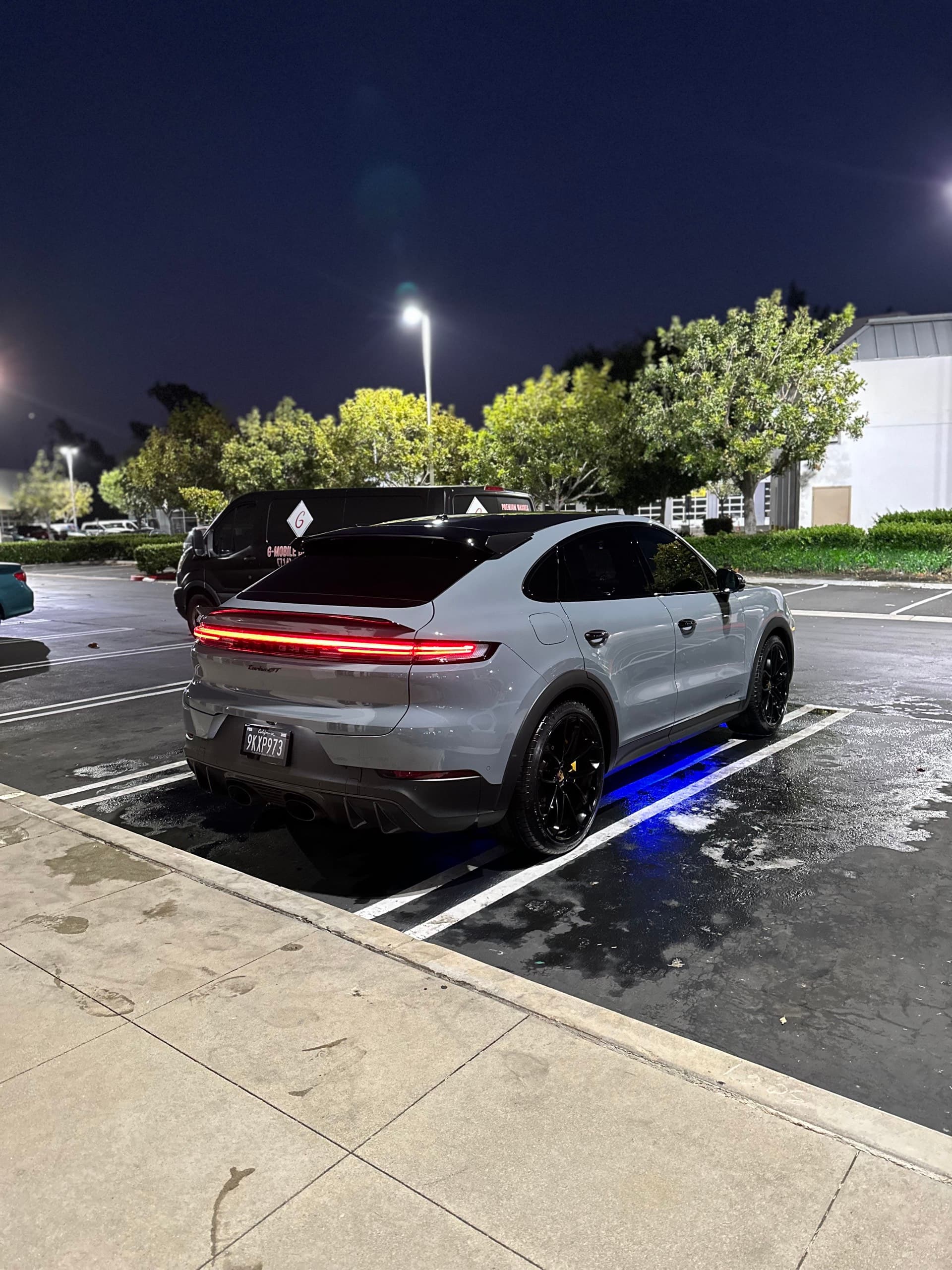 Gray Porsche Cayenne GTS detailed at night in Orange County