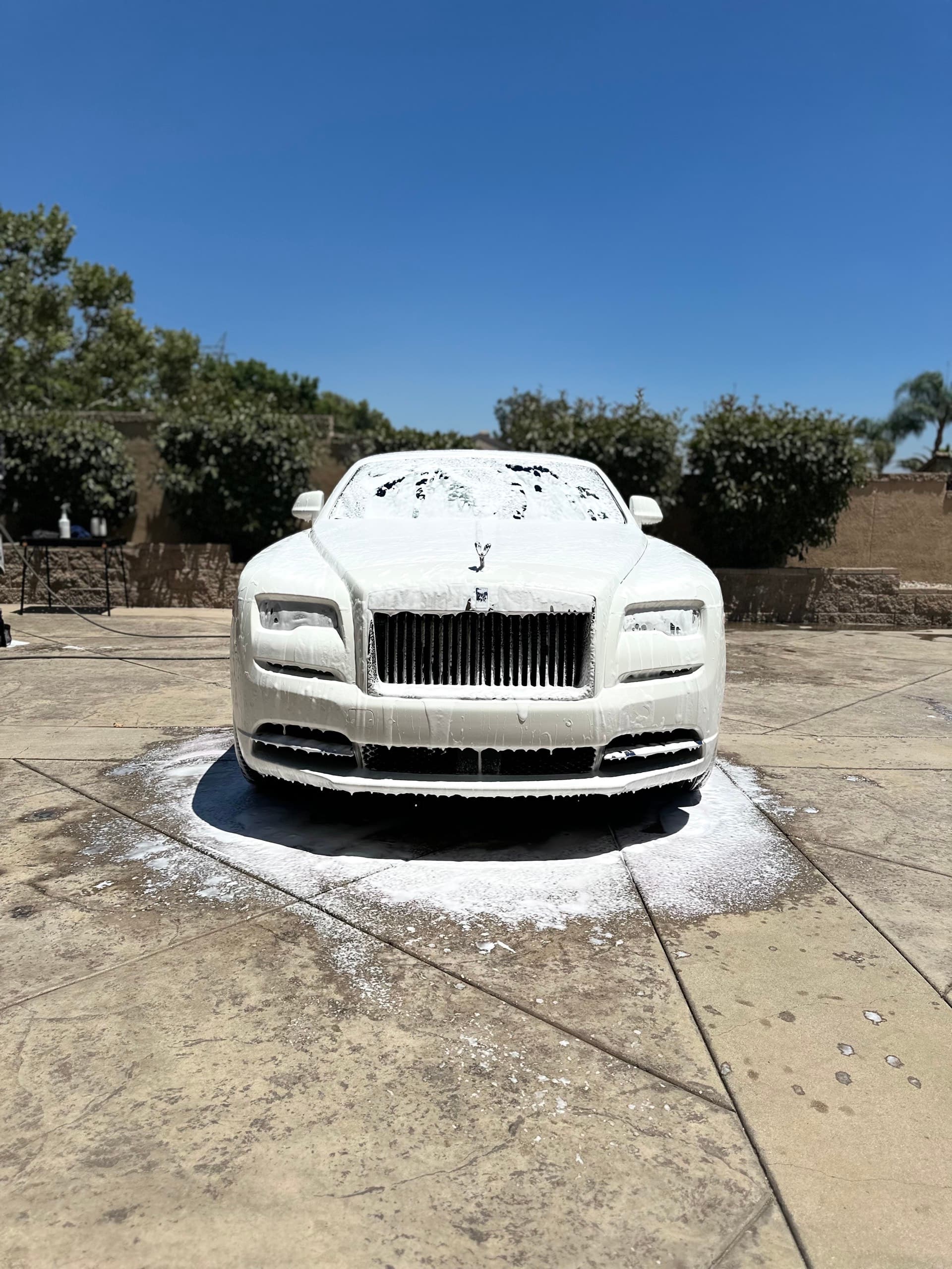 Rolls Royce Wraith foam wash on driveway in Orange County